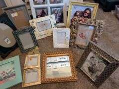 12 pc picture frames and mirror(located in ds back bedroom)
