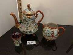 Japanese tea cup and saucer, tea pot, candlesticks and more (located in dining room)