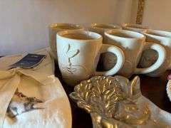 17 pc Easter lot, plates, platters, mugs, egg trays, etc. Stand not included (located in ds back roo