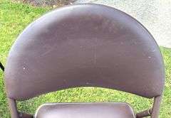 Black Folding Table, 33 5/8”X33 5/8”X27 7/8” (Some Wear) and Brown Folding Chair, 33 5/8” Tall (Smal
