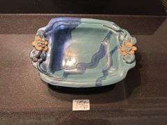 Palms up pottery dish, large ramekin, pair of square trays (located in kitchen)