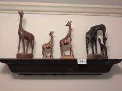 5pc. Shelf, 24" long with hand carved wooden giraffes from Kenya, tallest giraffe 7" tall (hallway)