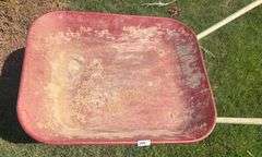 Red and White Wheel Barrow (Located Garage)