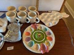 17 pc Easter lot, plates, platters, mugs, egg trays, etc. Stand not included (located in ds back roo