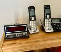 2 Shelf Lot of Phones, Flashlights and More (Located in Bedroom to The Right)