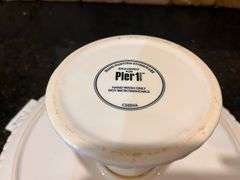 4 pc ”Fresh N’ Fruity” baking dishes and 10” Pier 1 Imports cake stands (located in kitchen)