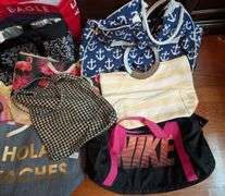 10 pc. Nike duffel bag, igloo bag, and tote bags (located in DS back bedroom)
