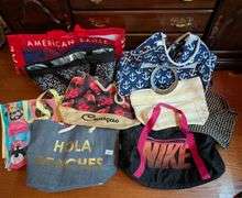 10 pc. Nike duffel bag, igloo bag, and tote bags (located in DS back bedroom)