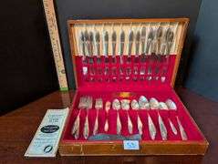 74 pc. Tutor Plate Oneida Community flatware with case(located in dining room)