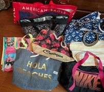 10 pc. Nike duffel bag, igloo bag, and tote bags (located in DS back bedroom)