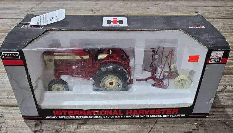 SpecCast International Harvester highly detailed international 340 utility tractor with IH model 251 planter, 1/16 scale die-cast metal replica tractor, die-cast planter frame.