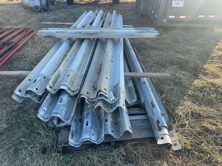 Approx 36 pieces of 14-ft guard rail and some extra pieces of small rail (one money bid)