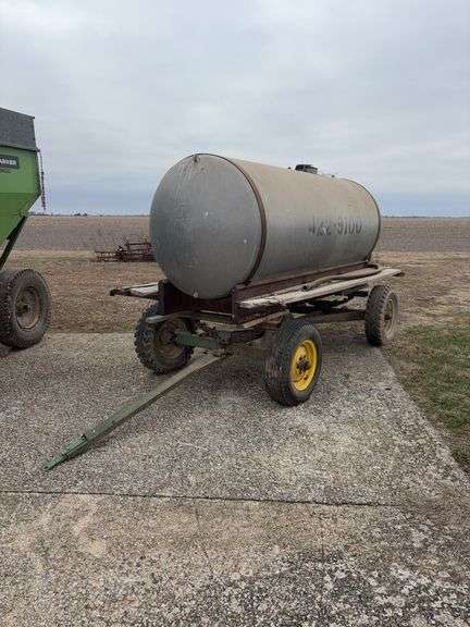 Homemade water tank on JD running gear, 1000gallon