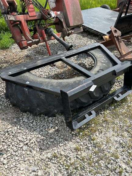 Tire manure scraper for skid steer shop built.