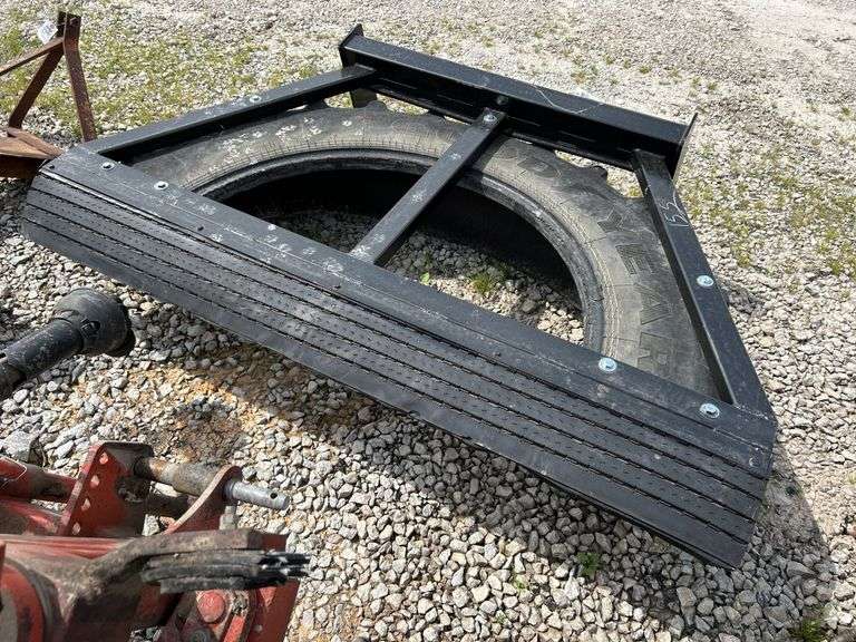 Tire manure scraper for skid steer shop built.