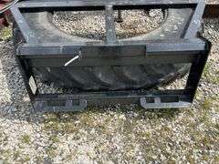 Tire manure scraper for skid steer shop built.