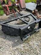 Tire manure scraper for skid steer shop built.
