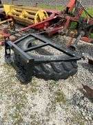 Tire manure scraper for skid steer shop built.