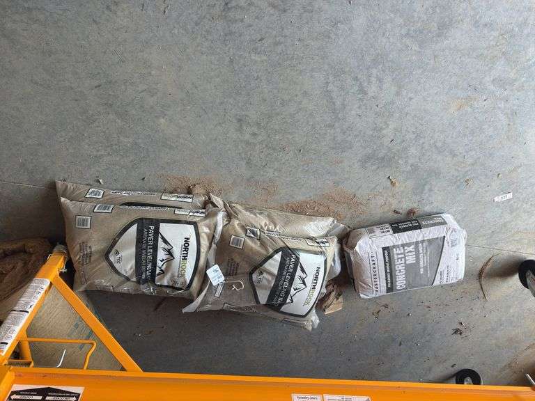 4 Bags of North Rock Paving/Leveling Sand and a bag of Concrete Mix