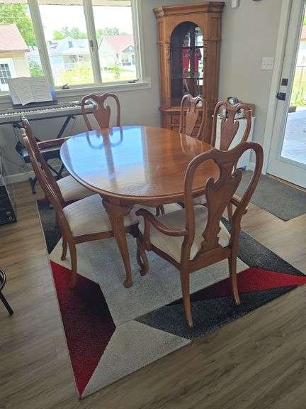 Oak oval table with 6 cushioned chairs approx 67" long