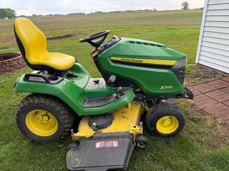 John Deere X590 riding mower 297 hrs. Accel 54" deck, hydro.