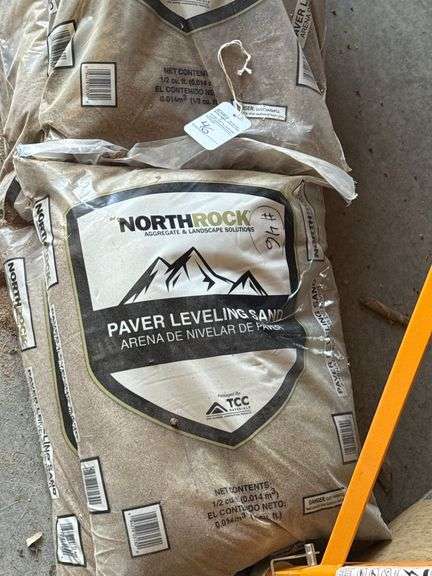 4 Bags of North Rock Paving/Leveling Sand and a bag of Concrete Mix