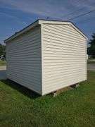 Portable shed 12'3"x10'3" 9' tall, 36"x80" door, on runners, buyers must remove