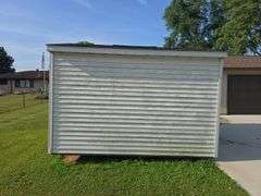 Portable shed 12'3"x10'3" 9' tall, 36"x80" door, on runners, buyers must remove