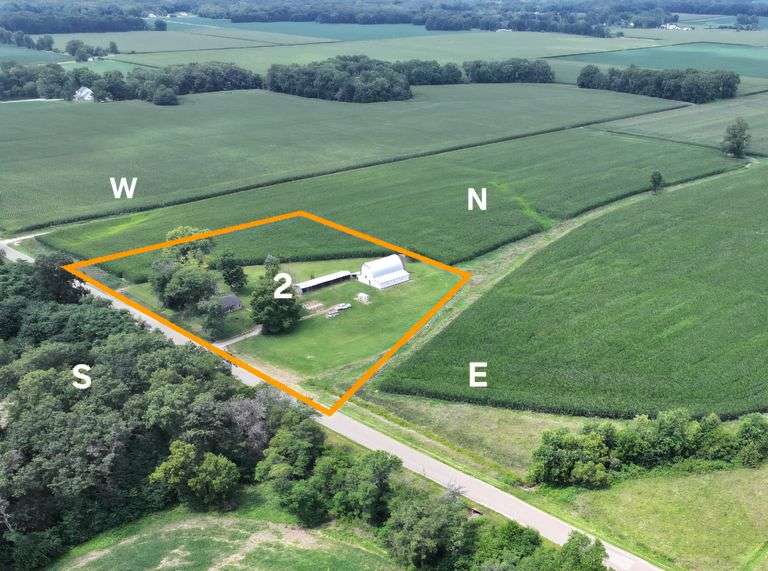 Tract 2 • 5 + or – acres Located in Sec 8, Moccasin Township, Effingham County, IL. 1008 Sq. Ft. house built approx. 1962 with full walkout basement (stairs), 2 bedrooms, 1 full bathroom, hardwood floors, 1600 sq. ft. pole building, 3,200 sq. ft. barn.  (ONE MONEY BID NOT BY THE ACRE, WINNING BIDDER WILL GET 5 ACRES)