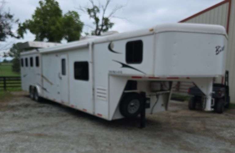 2011 Bison Dixie Ranch House Gooseneck horse trailer holds 4 horses, bigfoot hydraulic leveling system, living quarters is super nice, bathroom, couch, table, partial kitchen, stereo, bed. (excellent shape ready to go)