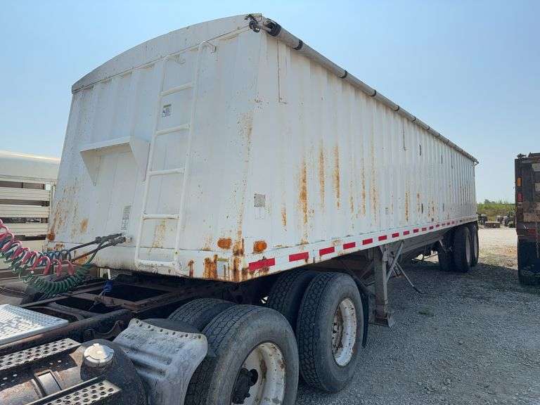 1997 Jet trailer 34ft steel hopper, new tarp 3 years ago, good tires, brakes, ready to haul, VIN# 5JNG34208VH000720, ( Lot 18, and 19 are extending together.  when there is a bid on either they both extend for 2 more minutes.  They do not sell together)
