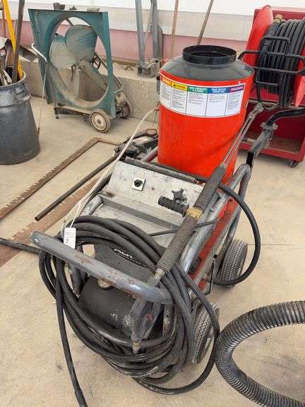 Alkta Model: 320AX4 pressure washer, has burner, hose reel, soap inductor, and wand