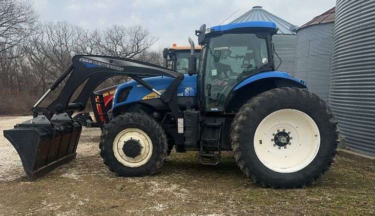 2010 New Holland T7050 tractor with 560 Westendorf loader and bucket, CVT, 31mph, FWA, 2,744 hours, 380/85R30 Front Tires, 195hp, 480/80R42 duals, small 1000pto, 540pto, 3pt, Heat/Ac, was a planting tractor, 1 owner s/n- ZABG04860. It has a regular lever for loader and bucket plus it has button on the control stick that runs the transmission, gear range, forward reverse and the button controls the loader