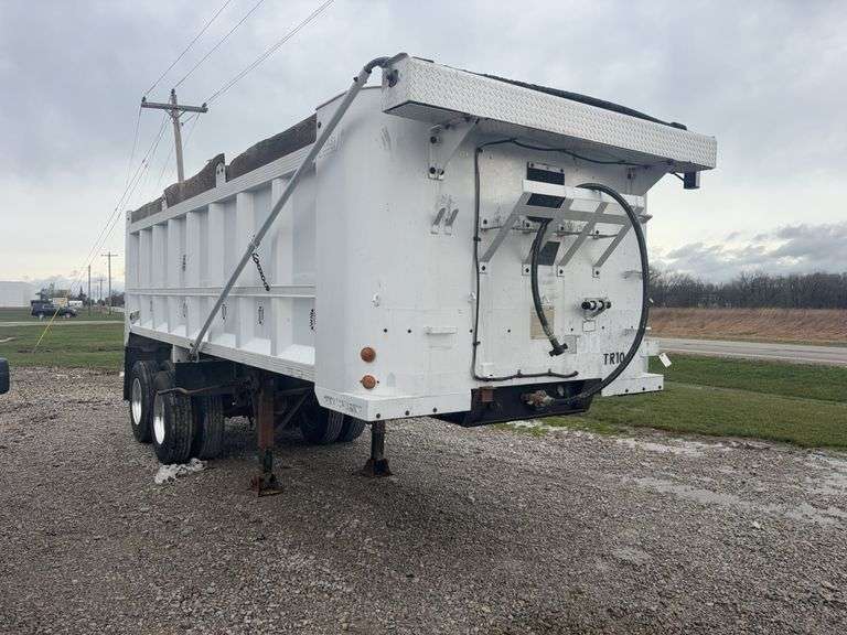1983 East 22ft Dump Trailer, Electric Tarp, 11r22.5 tires, outside aluminum wheels, hub pilot, new wheel bearings, brakes, hub, and air tail gate, rebuilt cylinder, solid floor, poly floor liner, grain chute, no cracks or welds, frame very solid