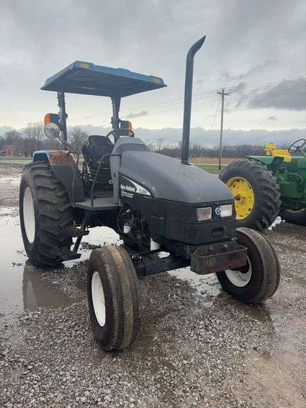 2003 Ford TL 100 Tractor, 2wd, Open Station, 540 pto, 3 remotes, shows 1704 hours, no drawbar, ABC, 1,2,3,4, 18.4x30, foam filled front tires.