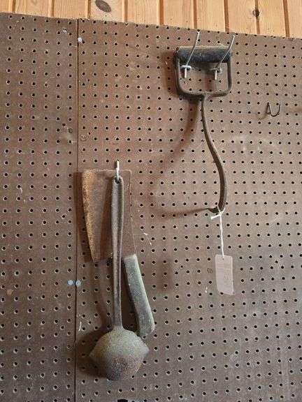 Vintage meat cleaver, vintage hay hook, and ladle.