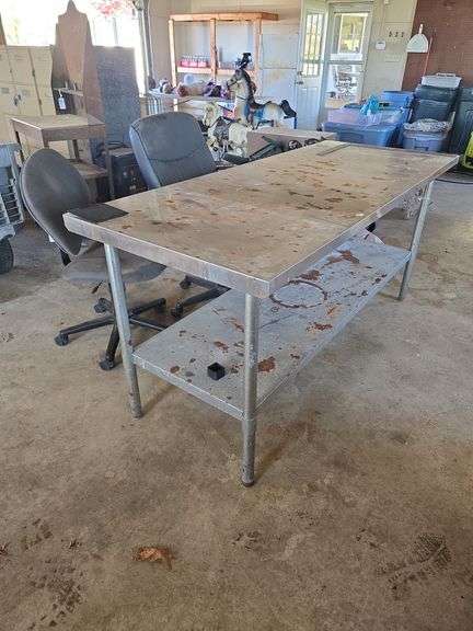 2 roll around office chairs and stainless table 6' long.