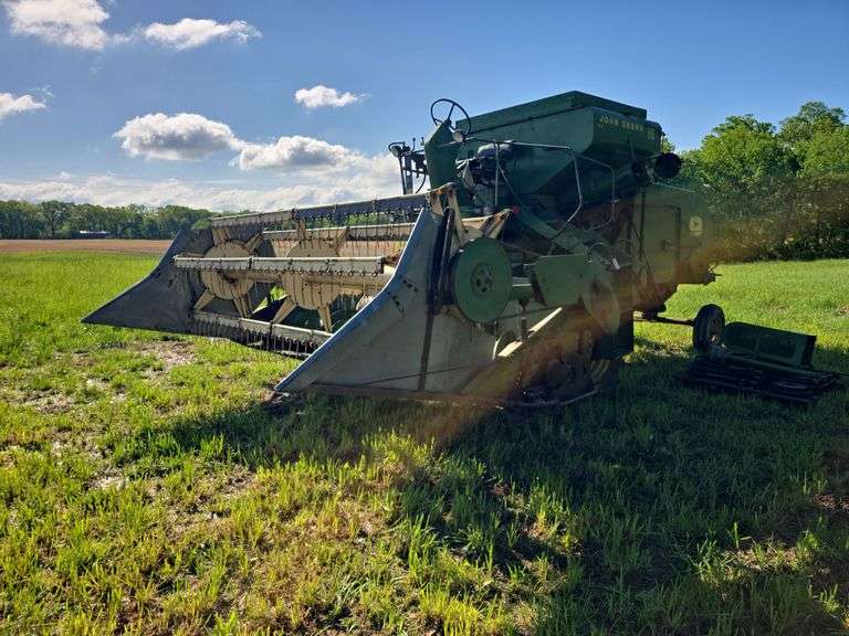 John Deere 55 Combine, 10ft Auger Head, 2wd, runs and operates, 4 speed, clover screens, extra parts, feeder house chain, sprockets