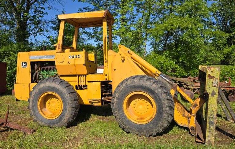 John Deere 544 C Pay Loader with forks, 6.8lt JD Engine, New Starter, 4,183 hours, All wheel drive, High, Low, and Reverse, 65'' Forks, 20,000lb forks, ( The last picture is a video of the machine running)