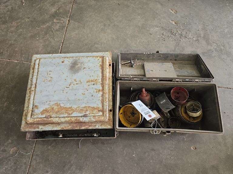 Large selection of hold saws and old breaker box.