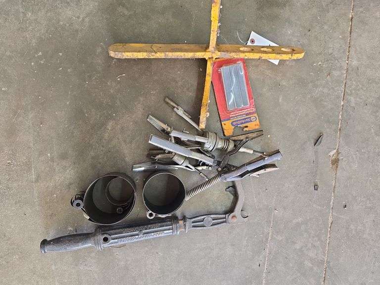 Tool used to take transmission out of road grader, ring compressor, and nail puller.
