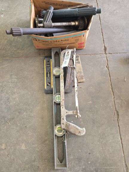 Levels, clutch lining tools, wedges, and hack saw.