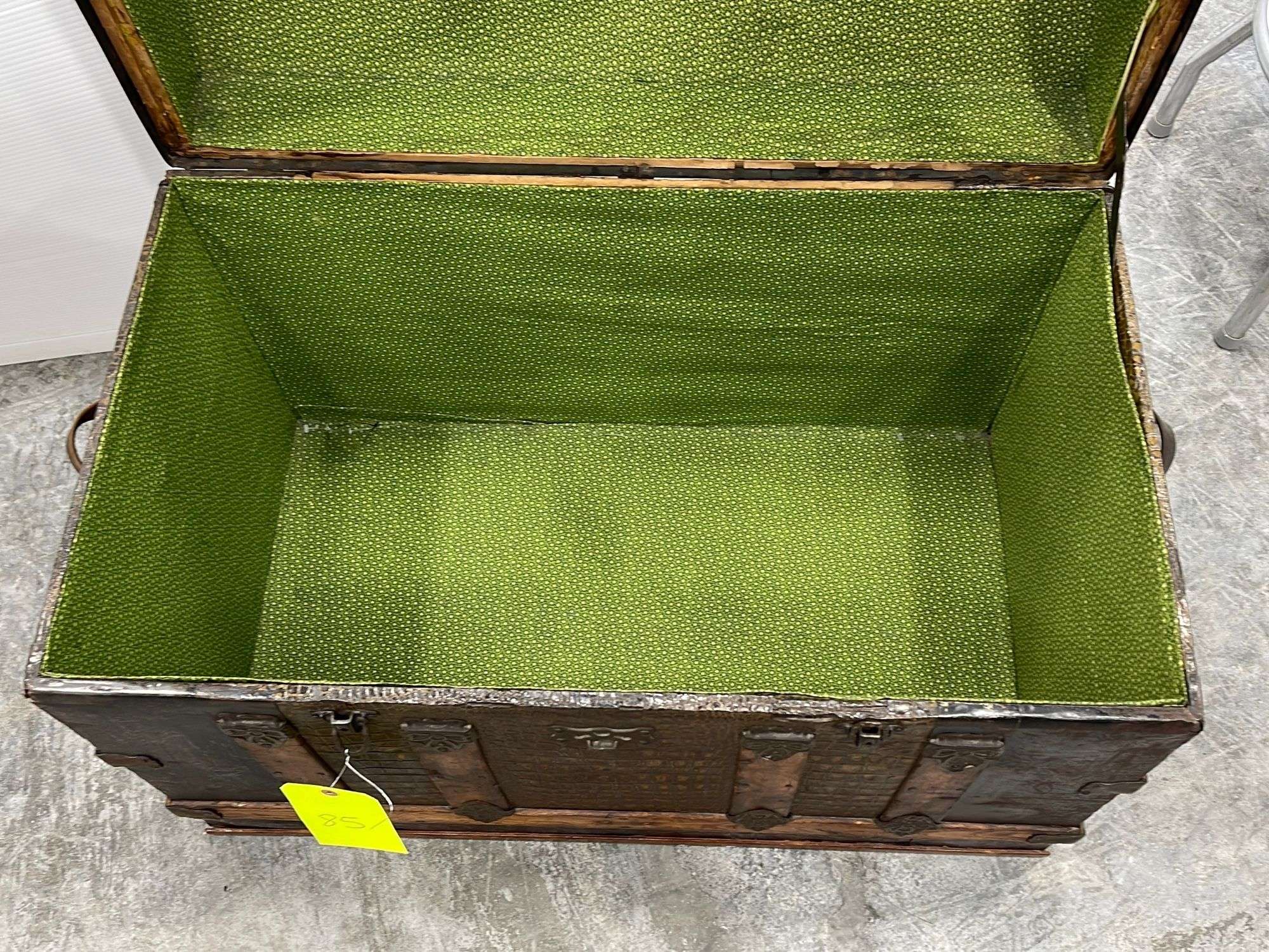 Antique camelback trunk - Schneider Auctioneers LLC