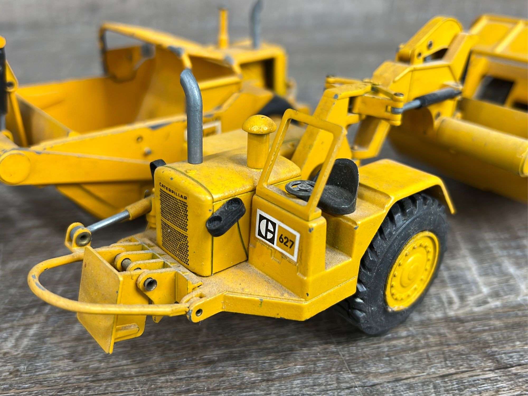 2 - Caterpillar 627 push-pull scrapers - Schneider Auctioneers LLC