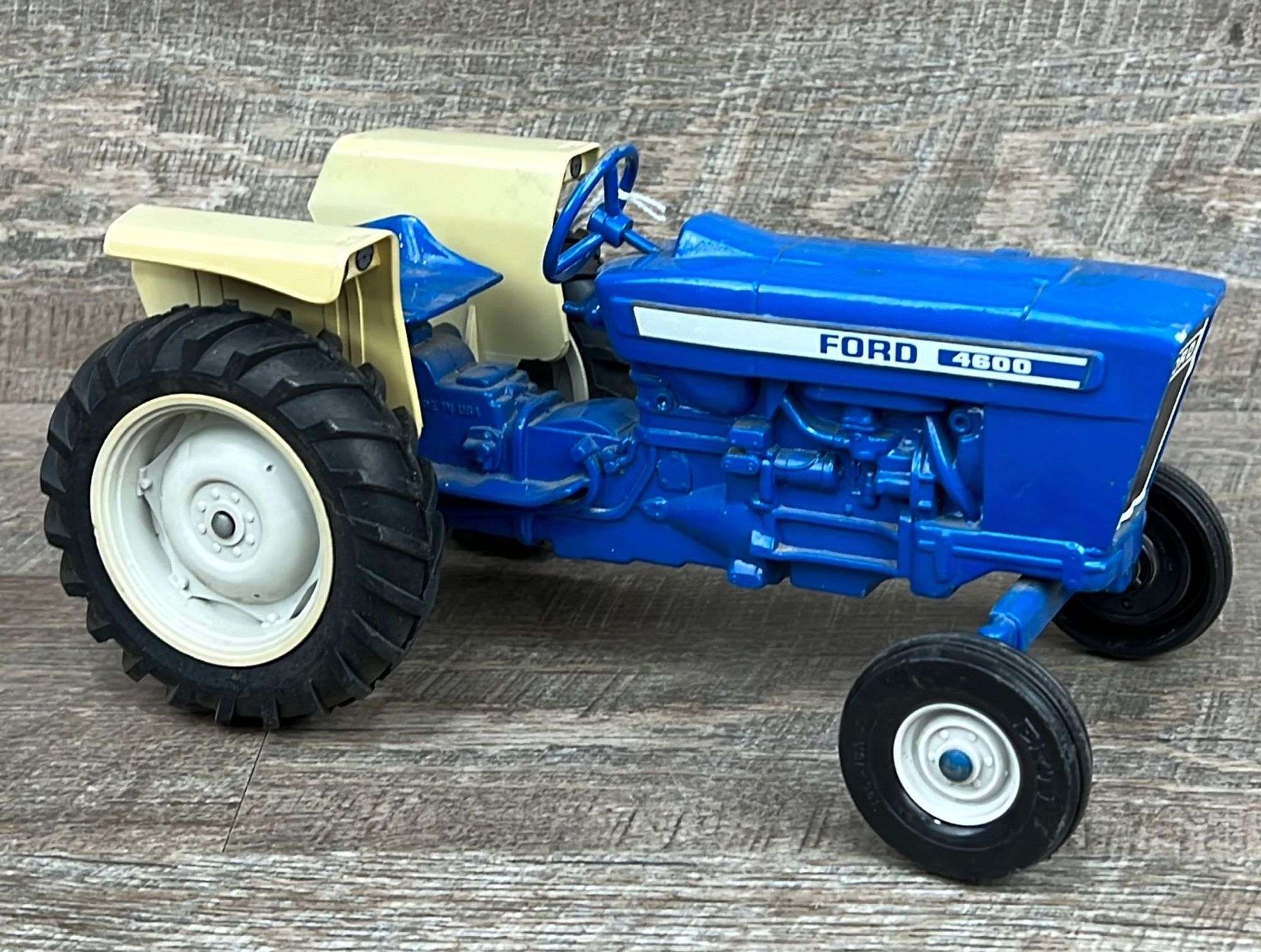 1/12 Ertl Ford 4600 tractor - Schneider Auctioneers LLC