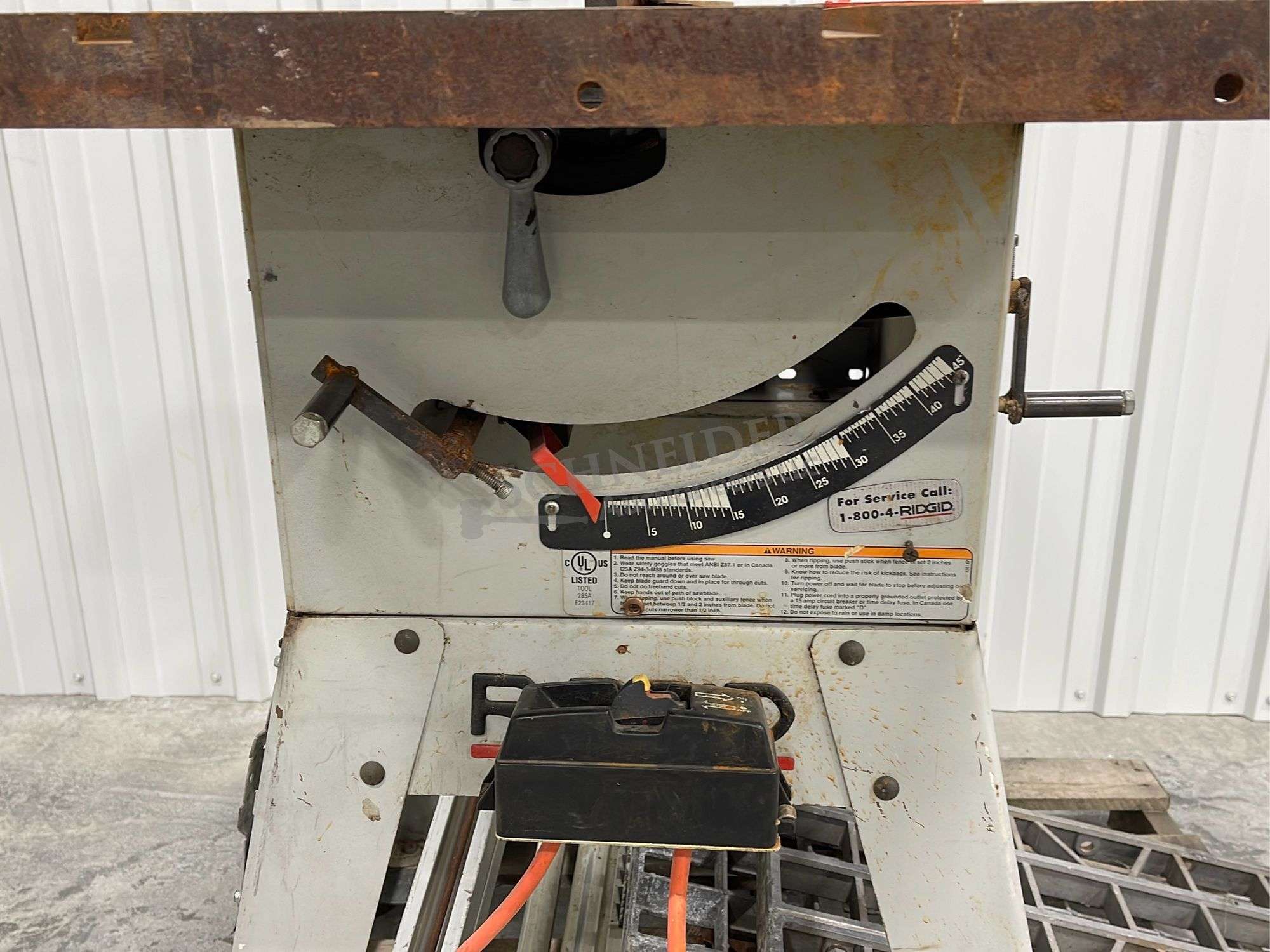 Ridgid model TS2412-1 table saw on stand - Schneider Auctioneers LLC