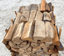 Group of seasoned oak firewood up to 16" long