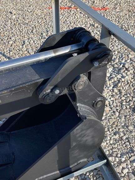 Unused skid steer fixed arm backhoe w/ 14" bucket