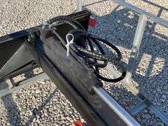 Unused skid steer fixed arm backhoe w/ 14" bucket