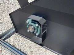 Unused skid steer mixing bucket